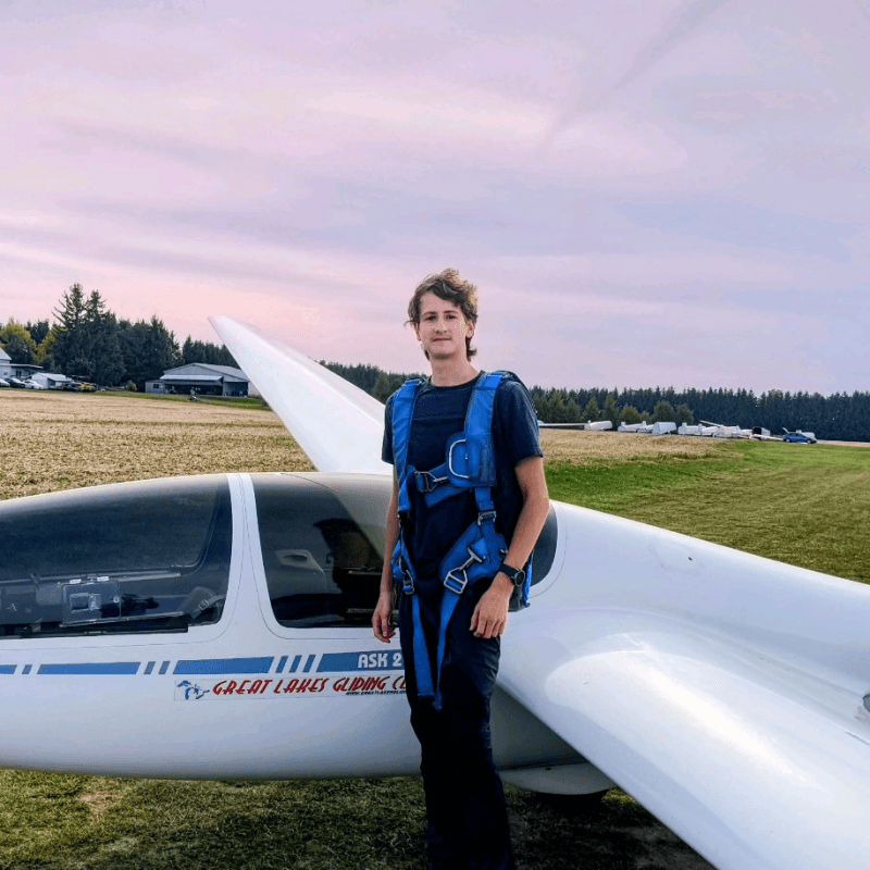 Kenneth with a glider at Great Lakes Gliding Club